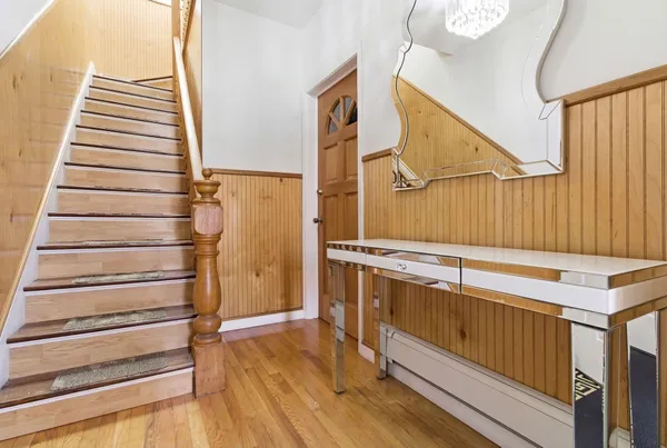 a view of entryway with wooden floor