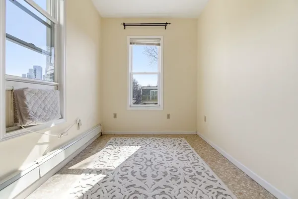 a bathroom with a bathtub and a window