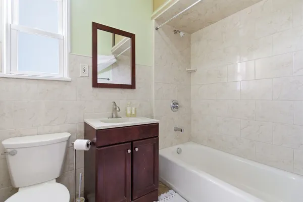 a bathroom with a sink toilet and bathtub