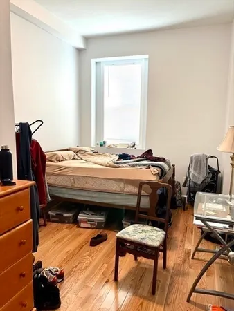 a bedroom with a bed and furniture