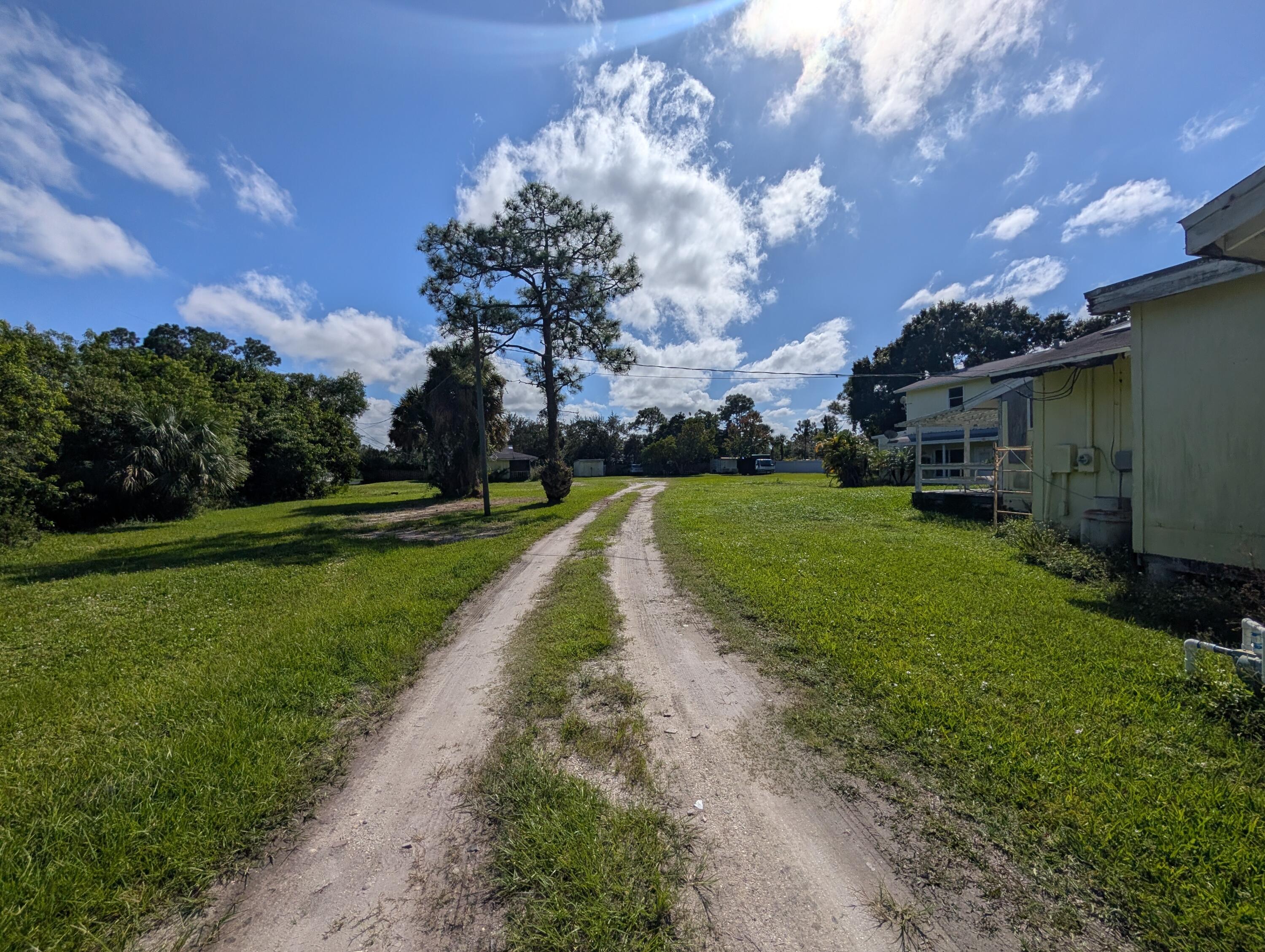1500 Southeast Cove Road Stuart, FL 34997 - Photo 11 of 22 a view of a park with large trees