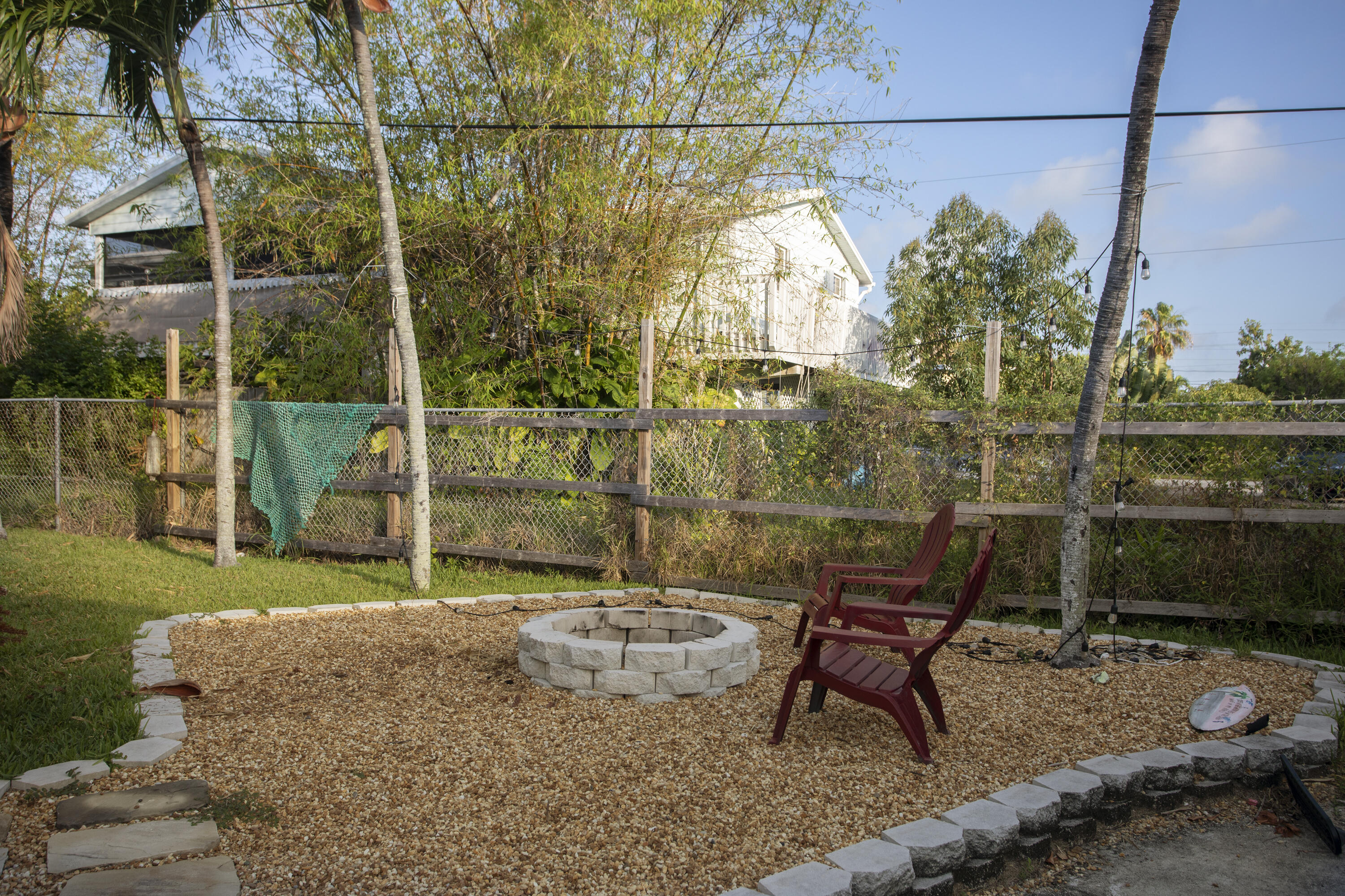 35 Dondi Road Key West, FL 33040 - Photo 3 of 15 a backyard of a house with table and chairs