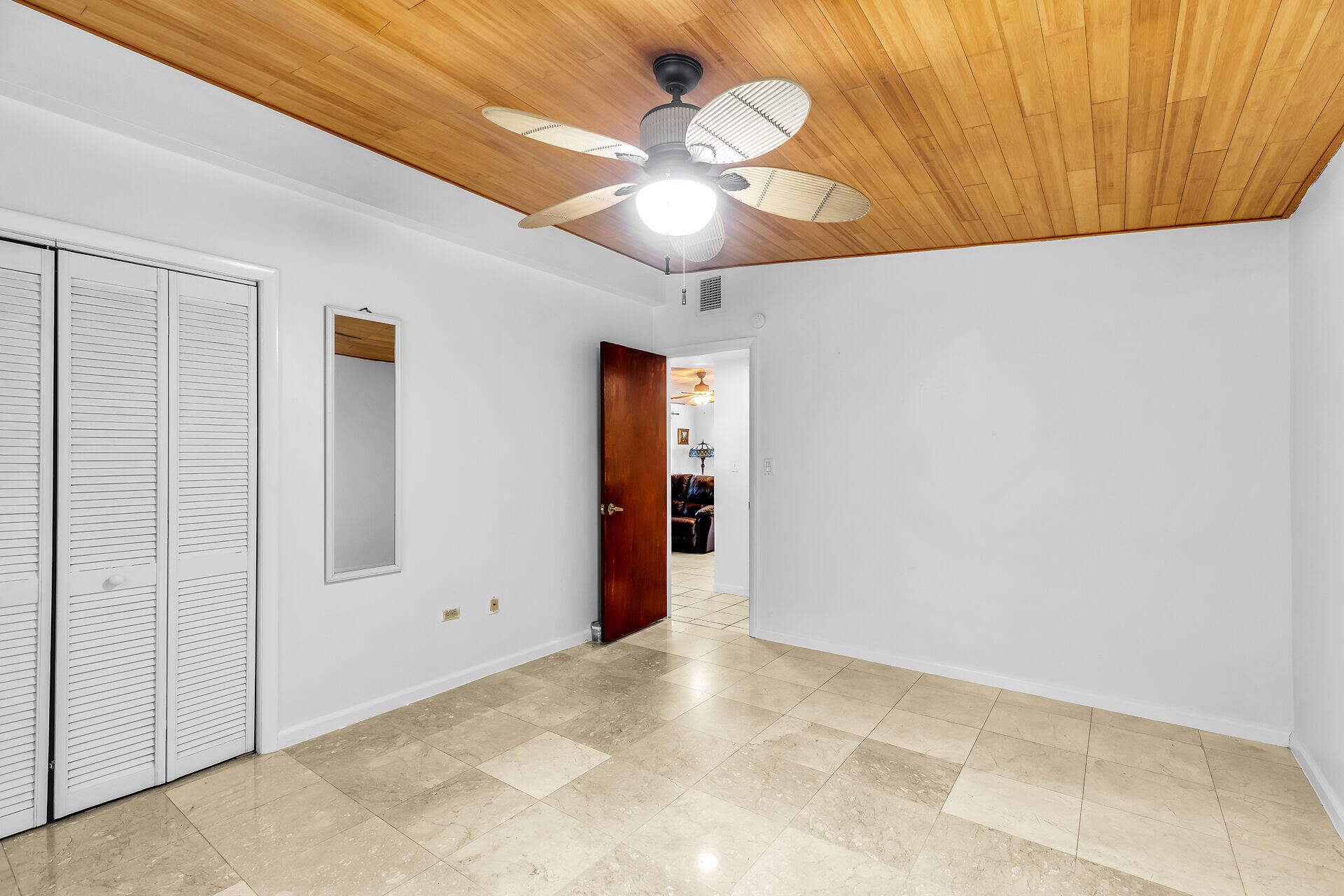 13 Bass Avenue Key Largo, FL 33037 - Photo 26 of 43 a view of an empty room with a ceiling fan