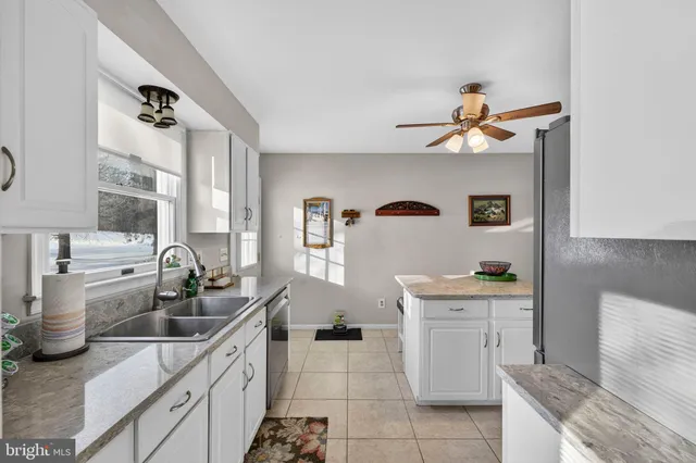 a kitchen with a refrigerator stove and microwave