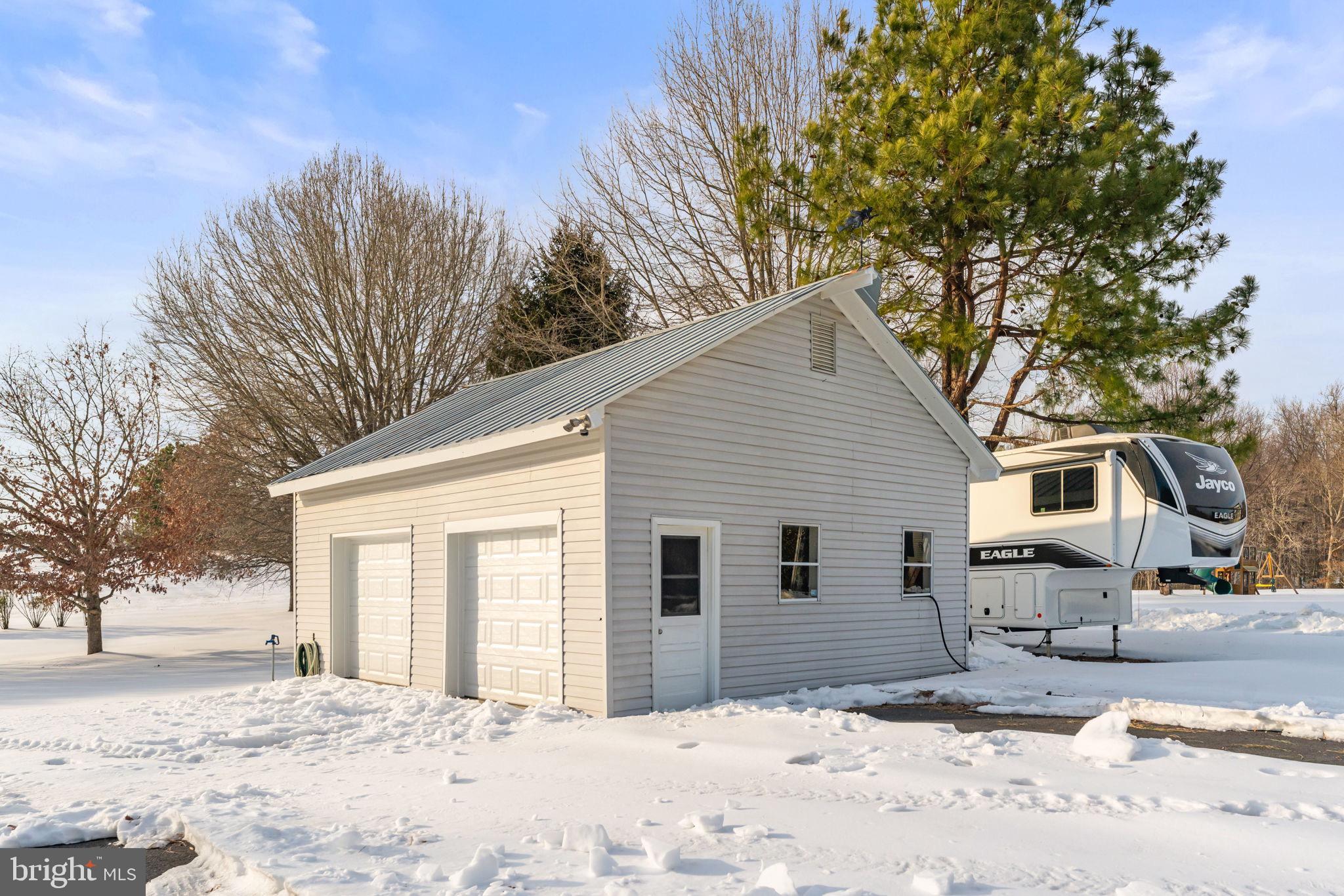 3460 Indian Run Road Amissville, VA 20106 - Photo 45 of 57 Charming garage nestled in a snowy landscape.