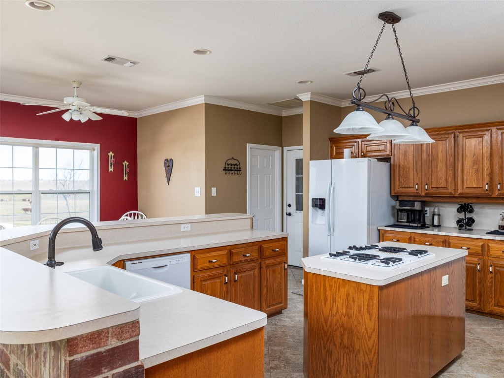 651 County Road 497 Taylor, TX 76574 - Photo 12 of 40 a kitchen that has a lot of cabinets in it