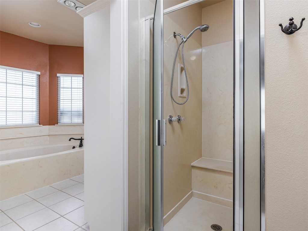 651 County Road 497 Taylor, TX 76574 - Photo 16 of 40 a bathroom with a shower and a tub