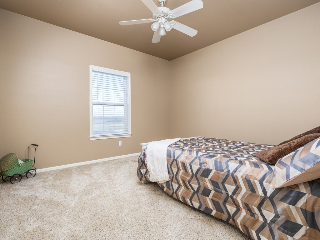 651 County Road 497 Taylor, TX 76574 - Photo 20 of 40 a bedroom with a bed and window
