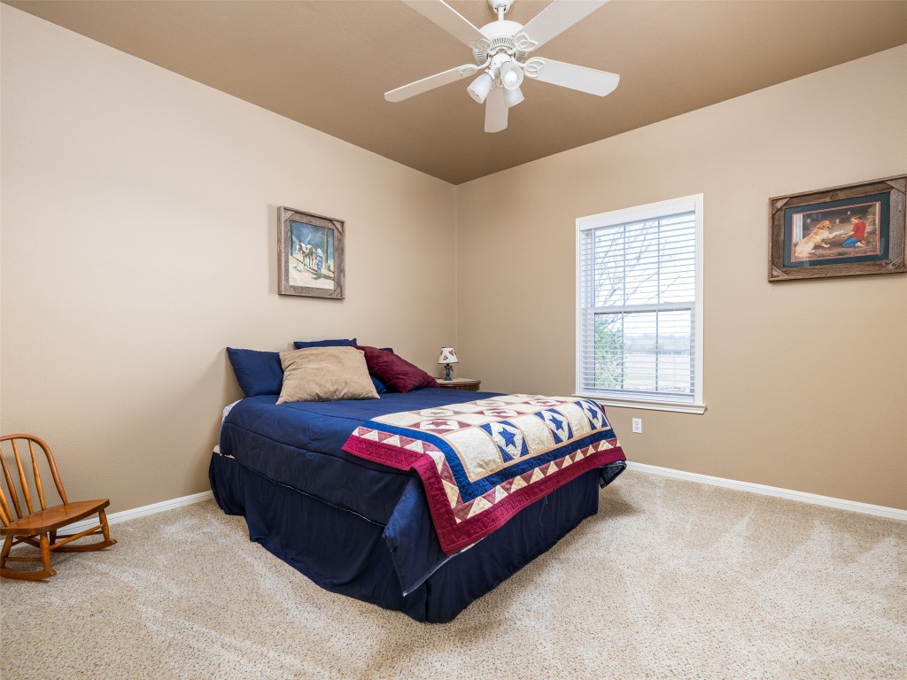 651 County Road 497 Taylor, TX 76574 - Photo 21 of 40 a bedroom with a bed rug and window