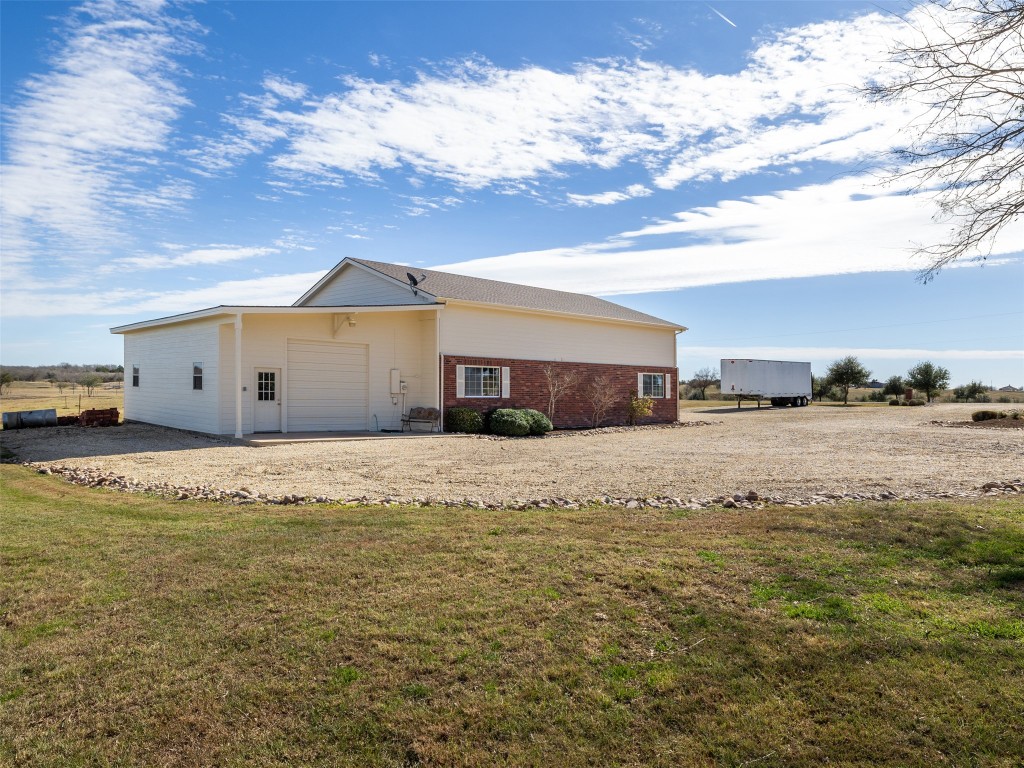 651 County Road 497 Taylor, TX 76574 - Photo 25 of 40 a view of a house with a yard