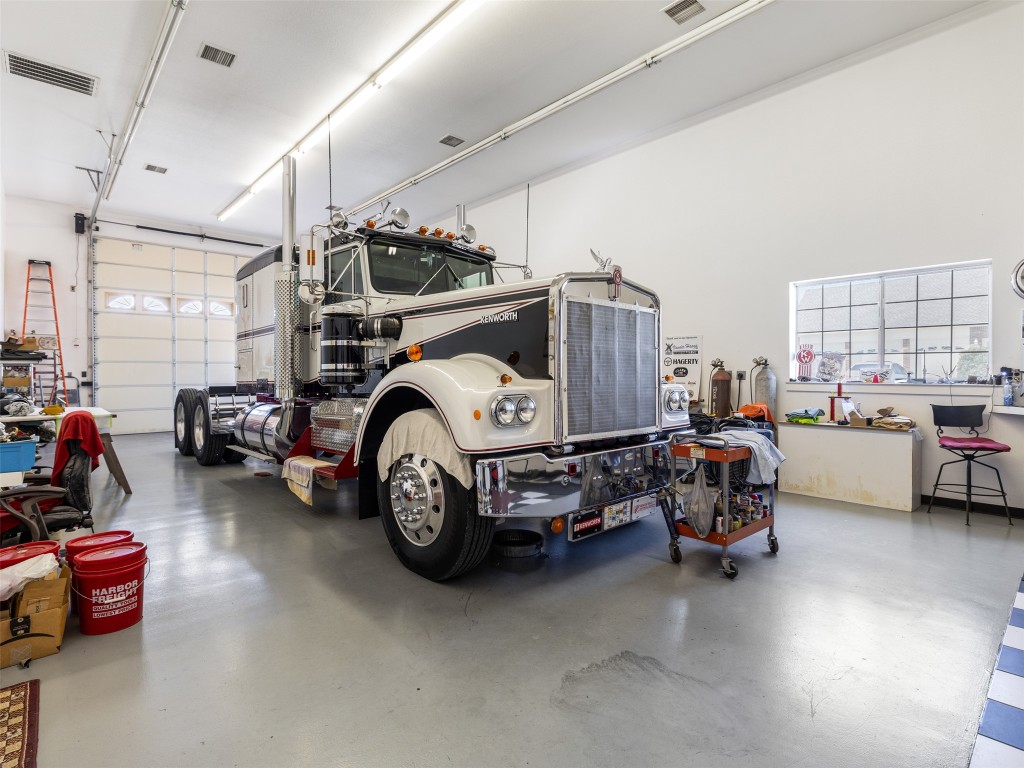 651 County Road 497 Taylor, TX 76574 - Photo 26 of 40 a car parked in a garage