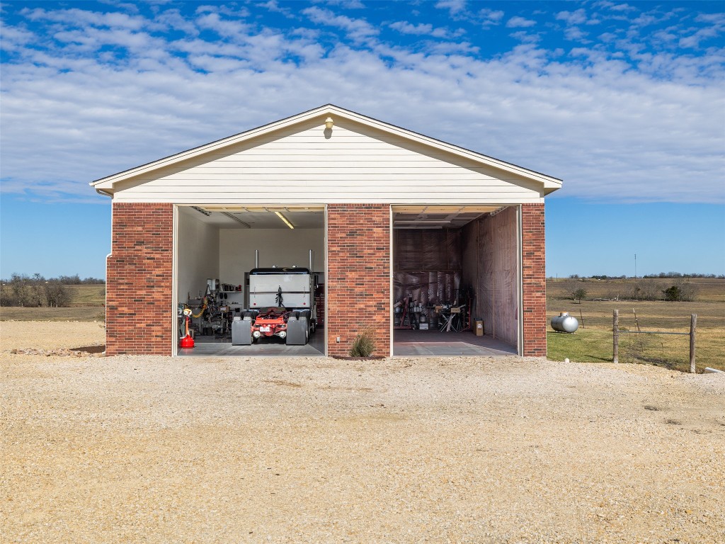 651 County Road 497 Taylor, TX 76574 - Photo 27 of 40 a view of a house with a patio