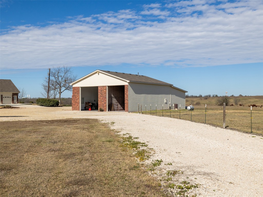651 County Road 497 Taylor, TX 76574 - Photo 29 of 40 a swimming pool with an outdoor space