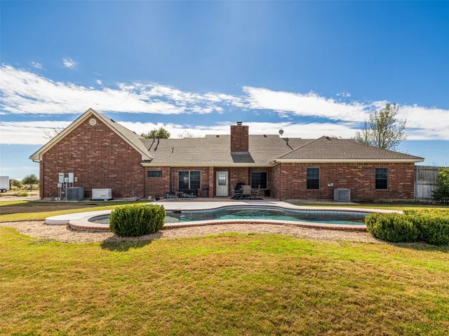 a view of a house with swimming pool