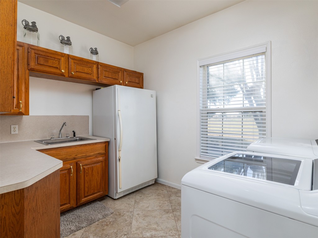 651 County Road 497 Taylor, TX 76574 - Photo 36 of 40 a utility room with dryer and washer