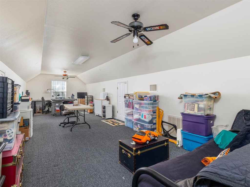 651 County Road 497 Taylor, TX 76574 - Photo 38 of 40 a living room with furniture and a flat screen tv