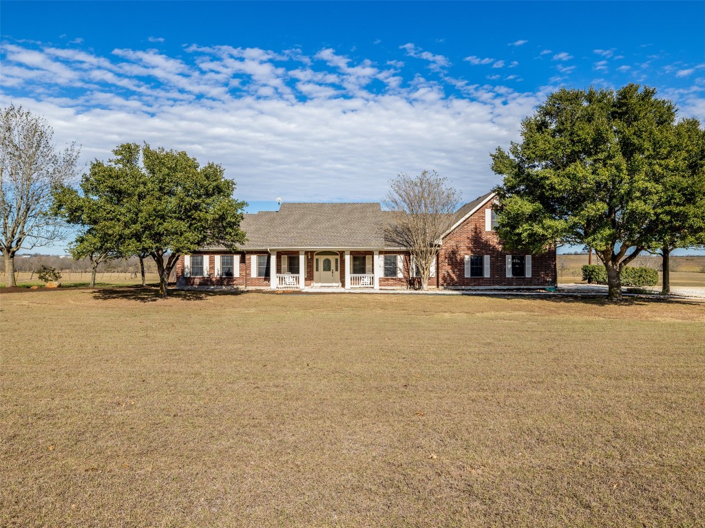 651 County Road 497 Taylor, TX 76574 - Photo 4 of 40 a front view of a house with a lake view
