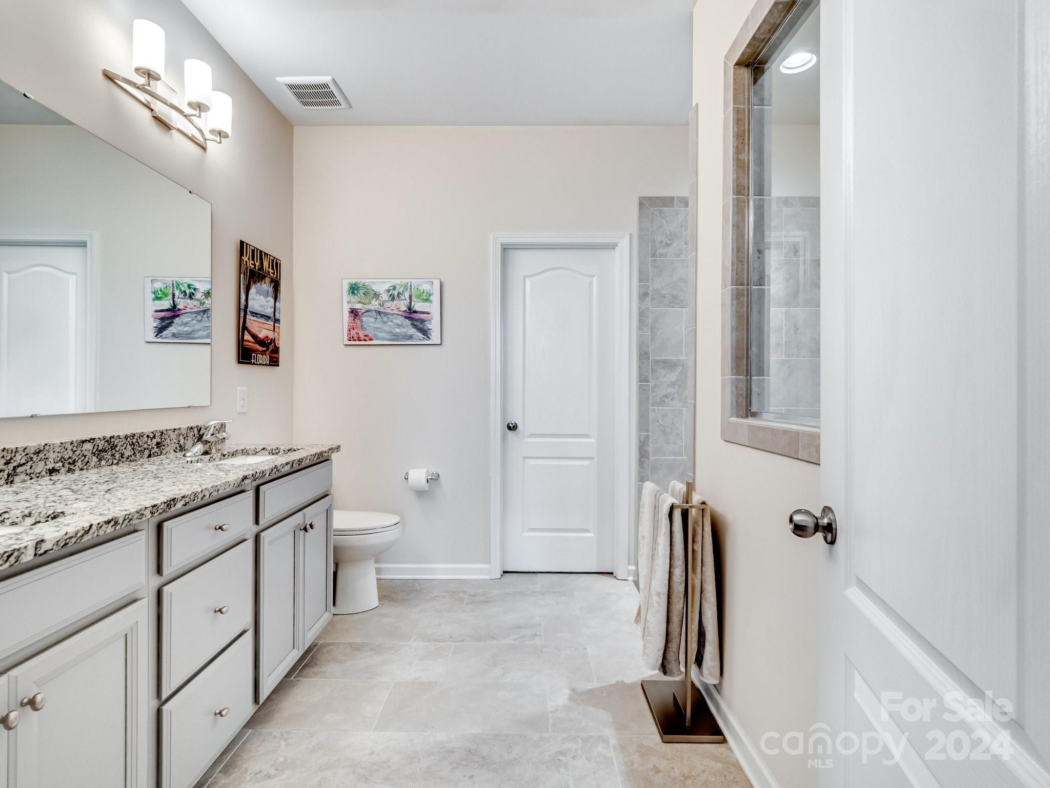 4239 Merrivale Drive Lancaster, SC 29720 - Photo 16 of 33 a spacious bathroom with a double vanity sink a toilet and a shower