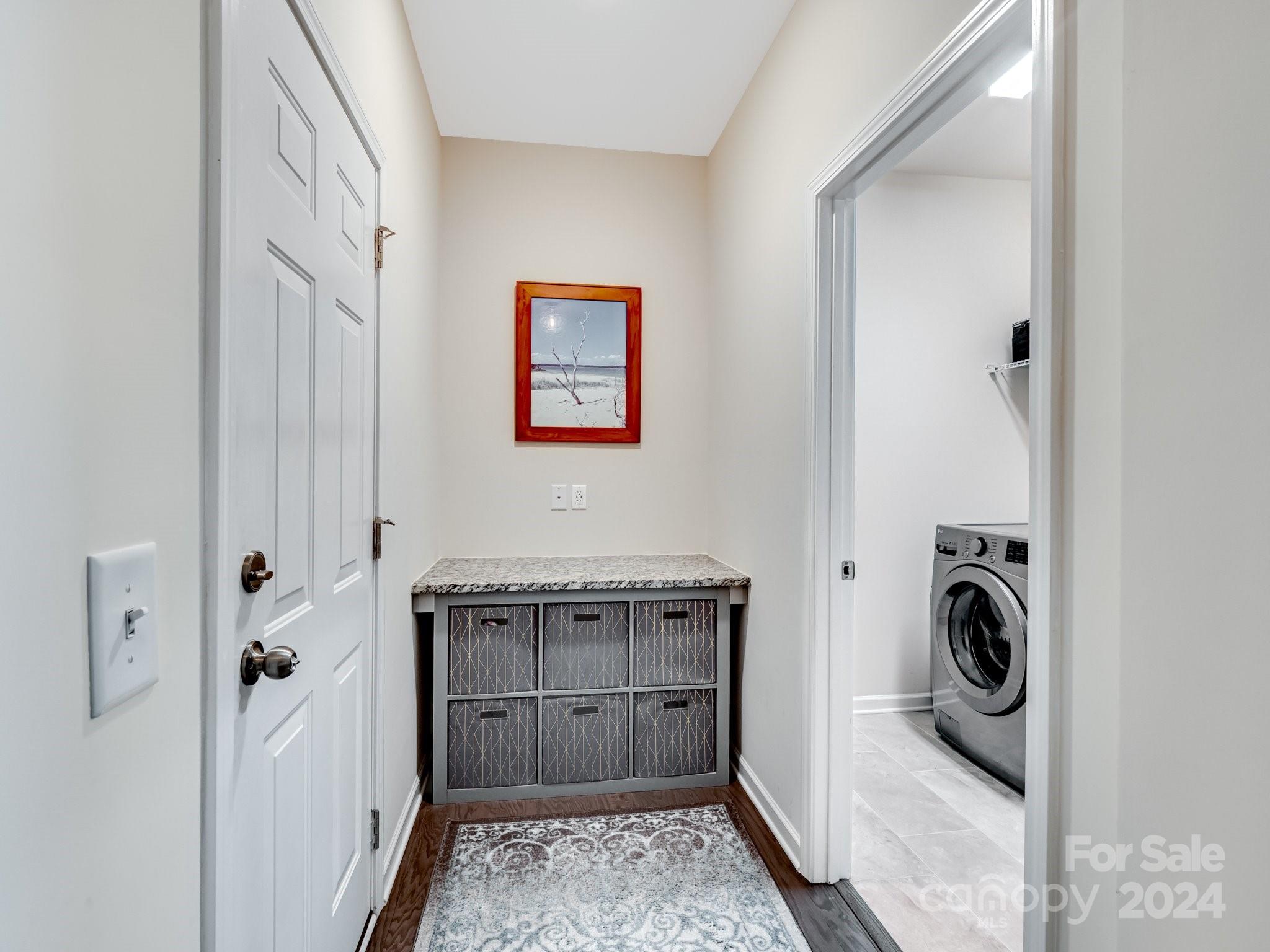 4239 Merrivale Drive Lancaster, SC 29720 - Photo 22 of 33 a view of a hallway with washer and dryer