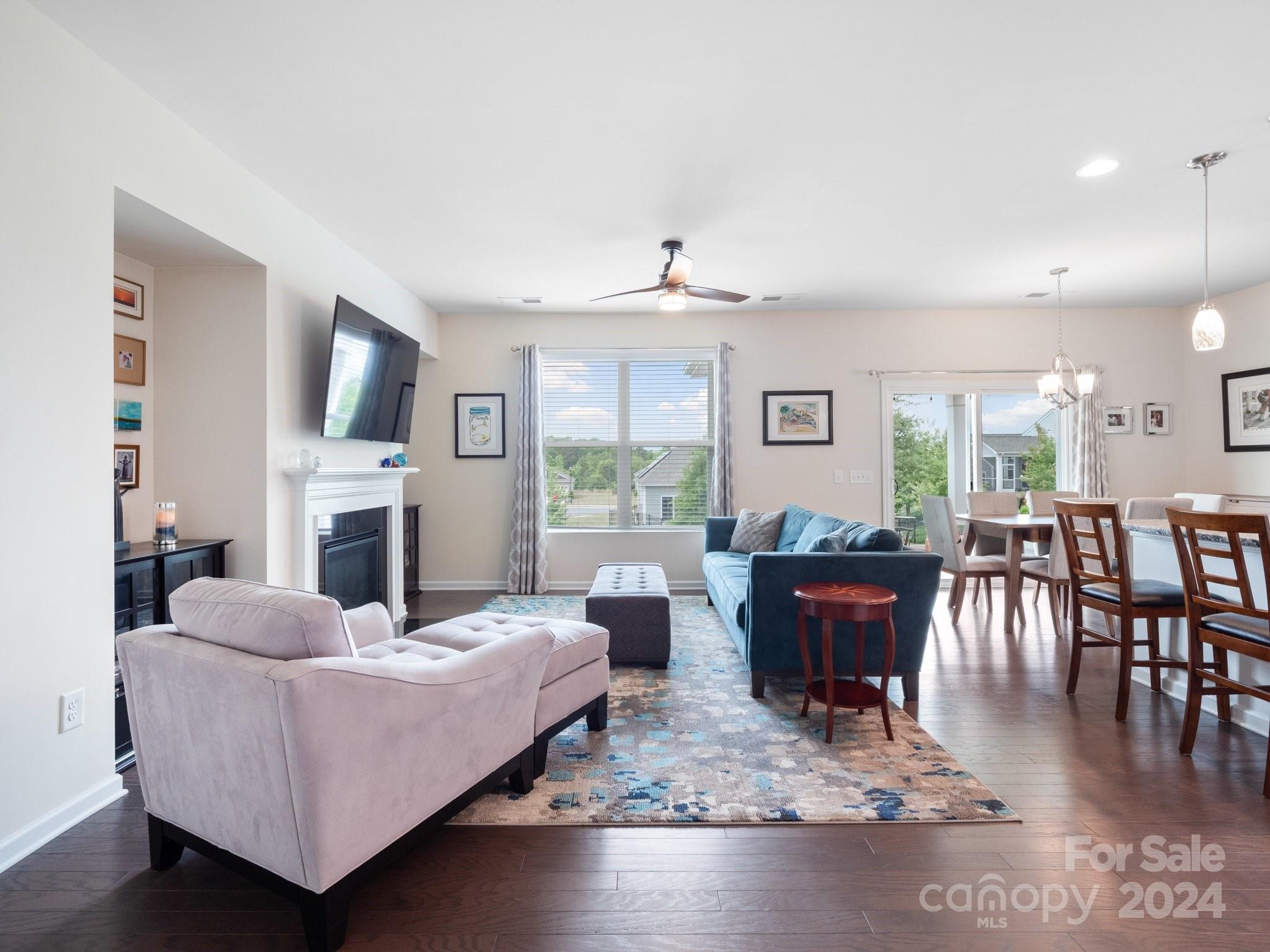 4239 Merrivale Drive Lancaster, SC 29720 - Photo 6 of 33 a living room with fireplace furniture and a large window