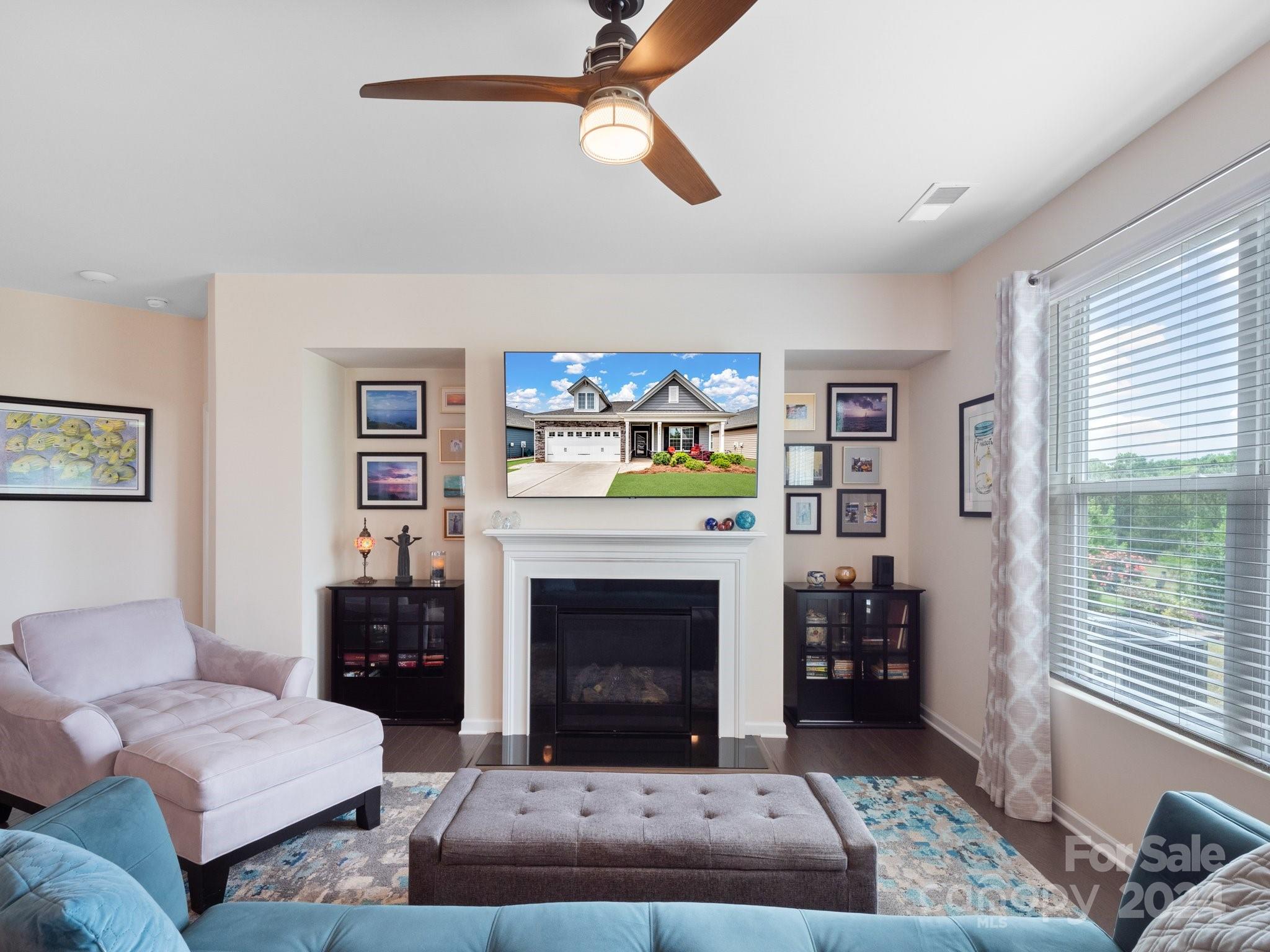 4239 Merrivale Drive Lancaster, SC 29720 - Photo 7 of 33 a living room with furniture a rug and a fireplace
