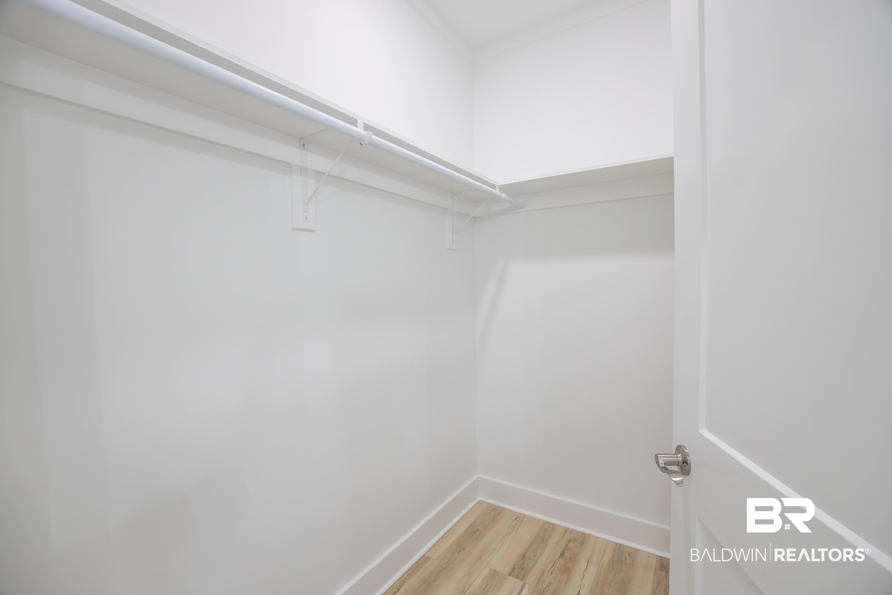27591 Canal Road Orange Beach, AL 36561 - Photo 29 of 51 Spacious closet featuring light wood-style flooring