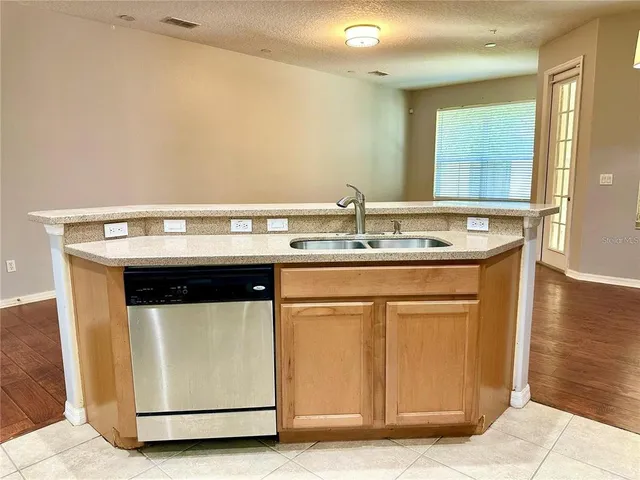 a sink a stove a microwave oven and a refrigerator