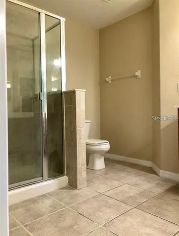 a view of a porch with a table and chairs