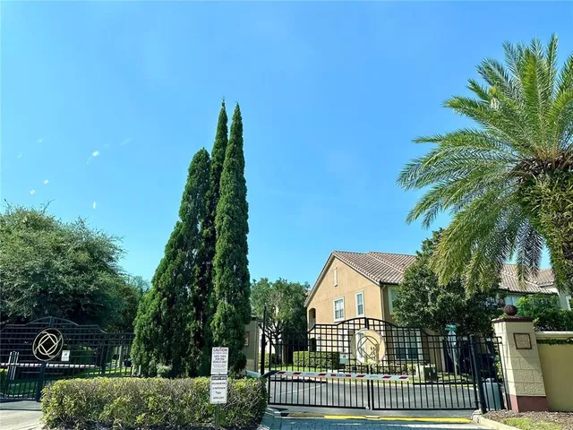a view of house and a yard