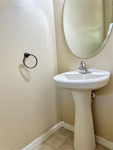 a bathroom with a sink and mirror