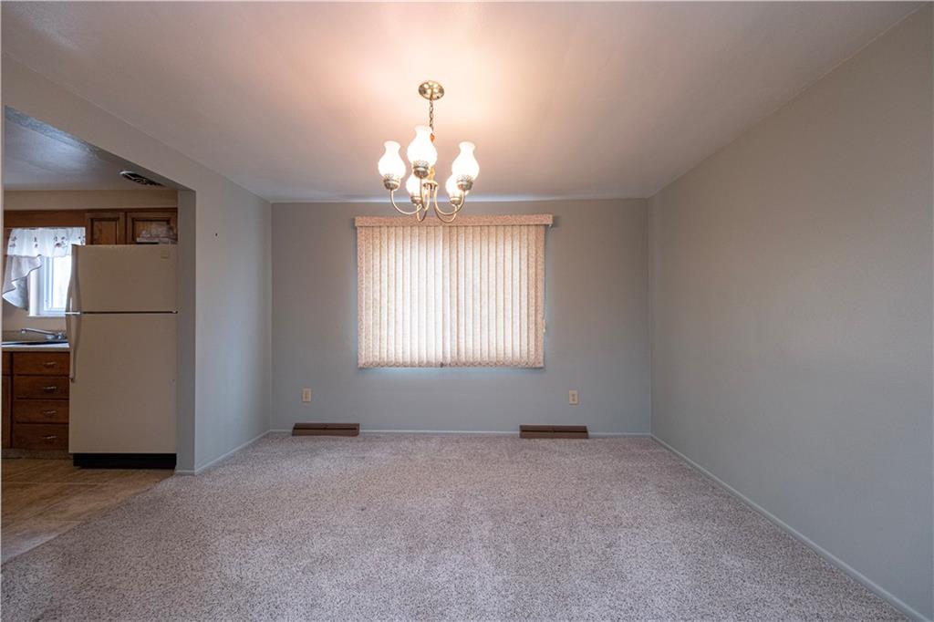 209 Video Drive Homestead, PA 15120 - Photo 11 of 33 an empty room with a view of a livingroom