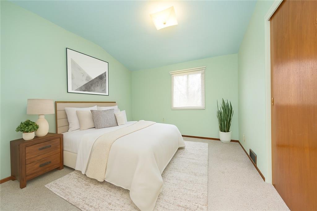 209 Video Drive Homestead, PA 15120 - Photo 5 of 33 a bedroom with a bed and painting on the wall