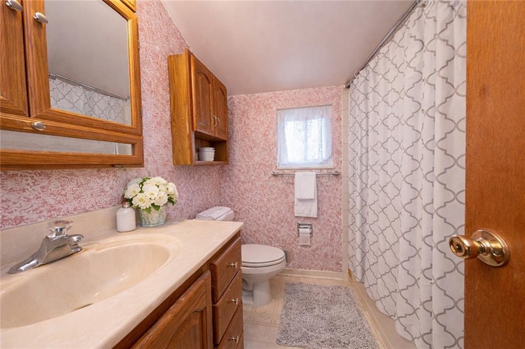 209 Video Drive Homestead, PA 15120 - Photo 7 of 33 a bathroom with a sink and a mirror