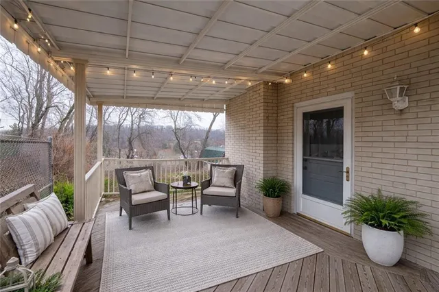 a outdoor living space with furniture and a potted plant
