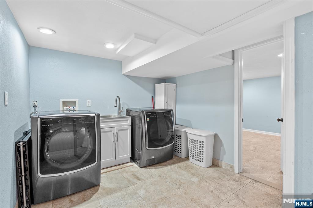 71 Wingra Avenue Rutherford, NJ 07070 - Photo 17 of 20 a utility room with sink dryer and washer
