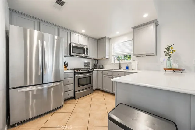 a bedroom with a bed and glass walk in closet