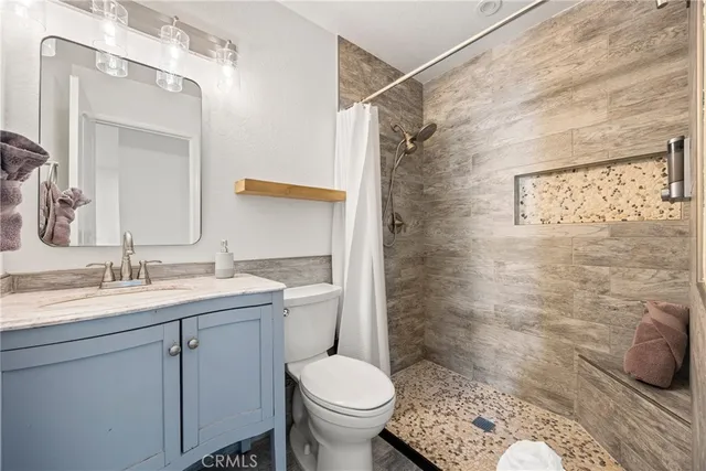 a view of a livingroom with furniture and a window