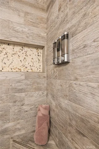 a bedroom with a bed and a table