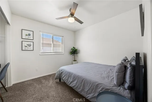 a bedroom with a bed and lamp