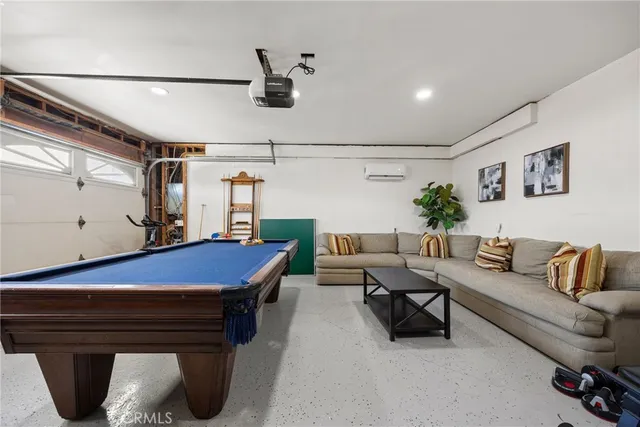 a view of a house with swimming pool and sitting area