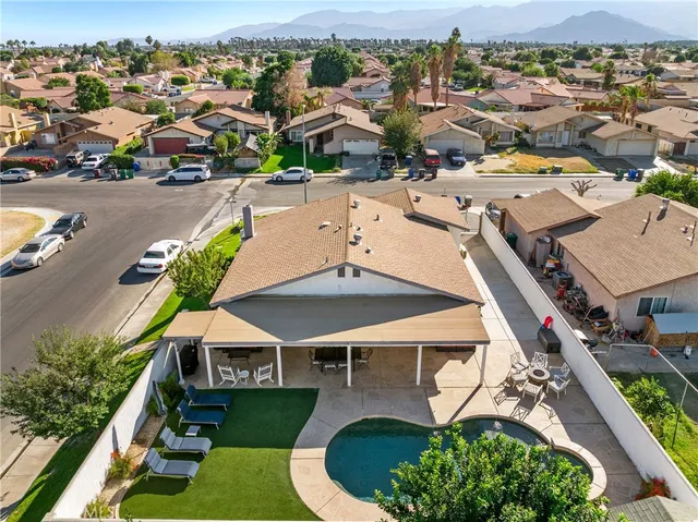 an aerial view of a house with a swimming pool