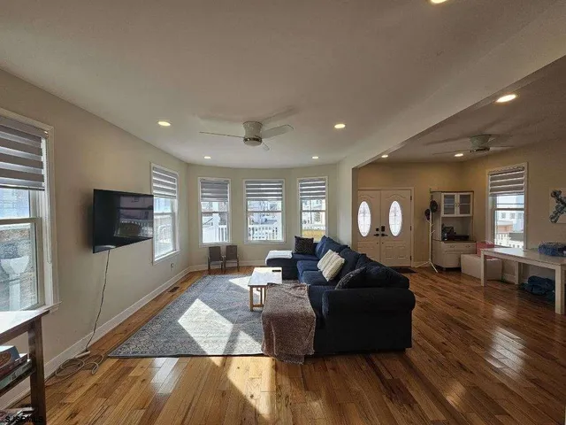 a view of a roof deck with wooden floor and fence