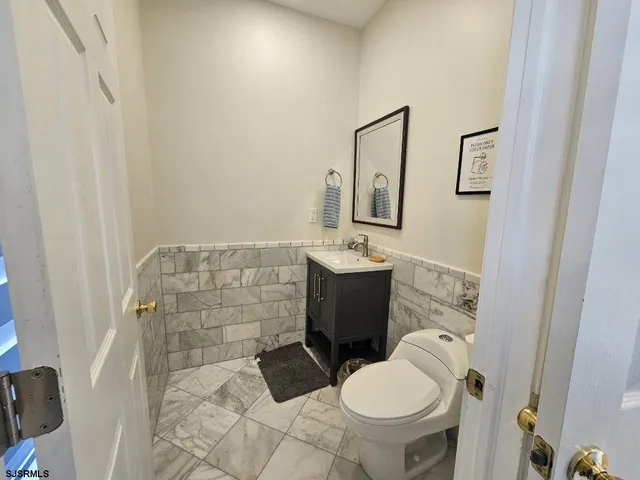 a bedroom with a bed and a television