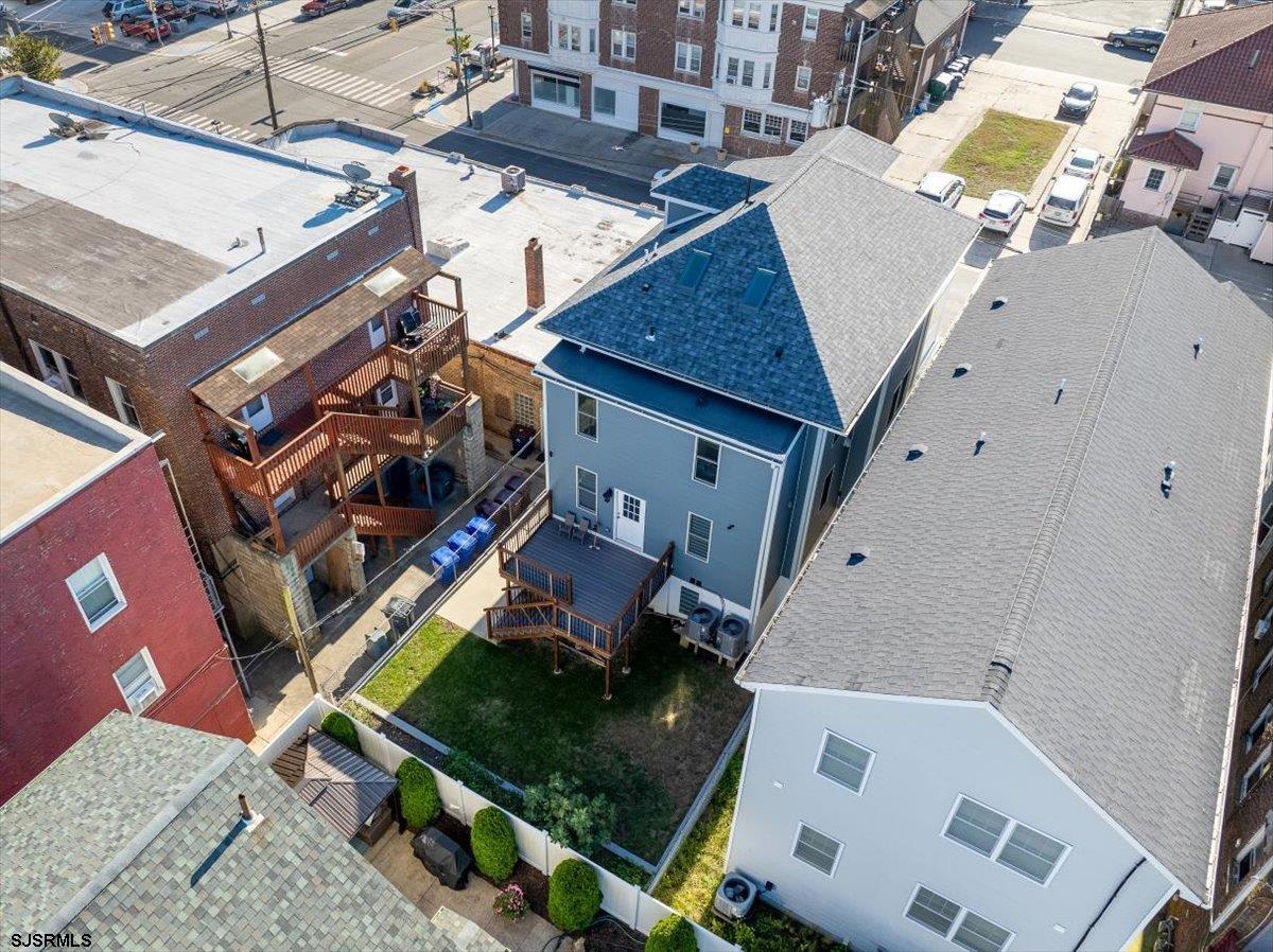 27 South Little Rock Avenue, Unit JUNE 2026 Ventnor City, NJ 08406 - Photo 59 of 91 an aerial view of a house with a yard