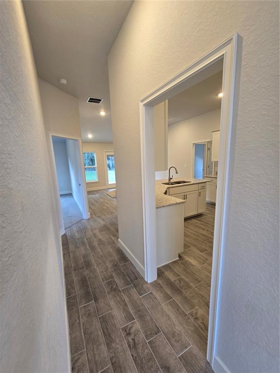 1117 Heron Point Drive Inverness, FL 34453 - Photo 6 of 19 a view of a kitchen cabinets and wooden floor