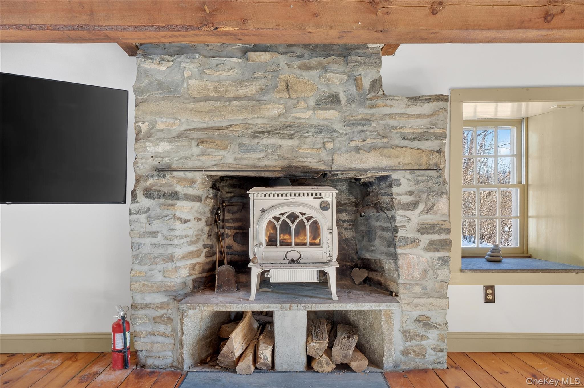 168 Old Rte 55 Pawling, NY 12564 - Photo 7 of 50 Fireplace with wood burning stove insert.