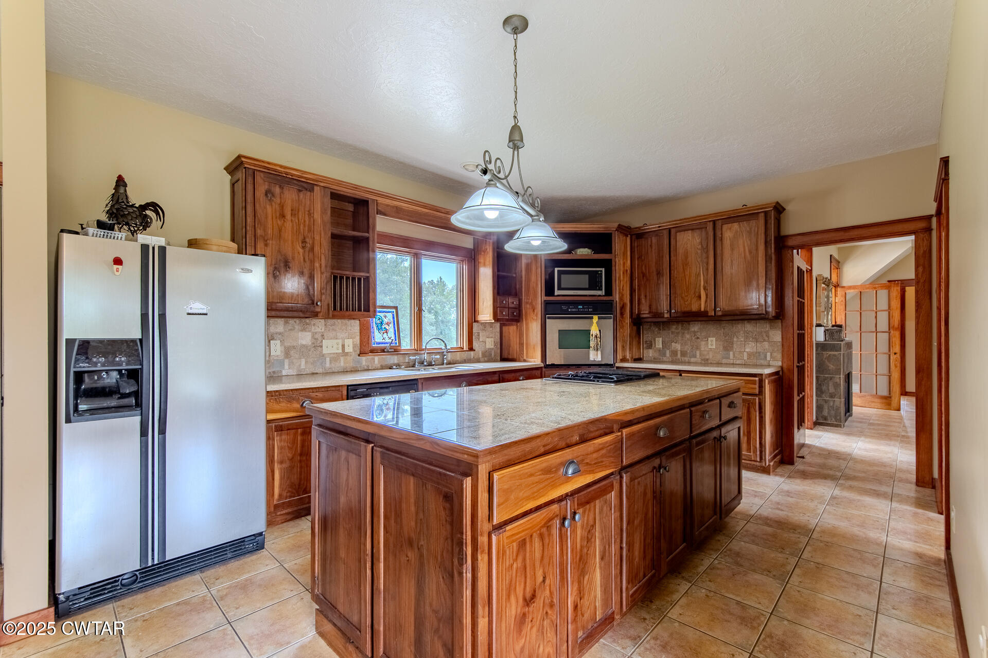 3554 Shades Bridge Road Greenfield, TN 38230 - Photo 10 of 49 a kitchen with stainless steel appliances granite countertop a stove and a refrigerator