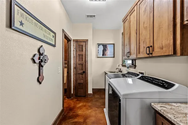 a kitchen with a refrigerator and a sink