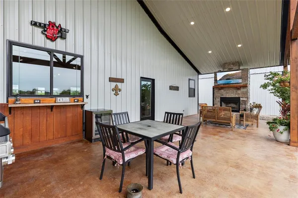 a view of a dining room with furniture window and outside view