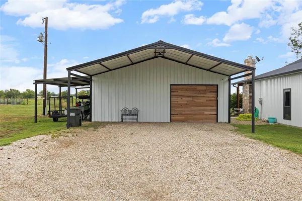 a house with huge green field in front of it